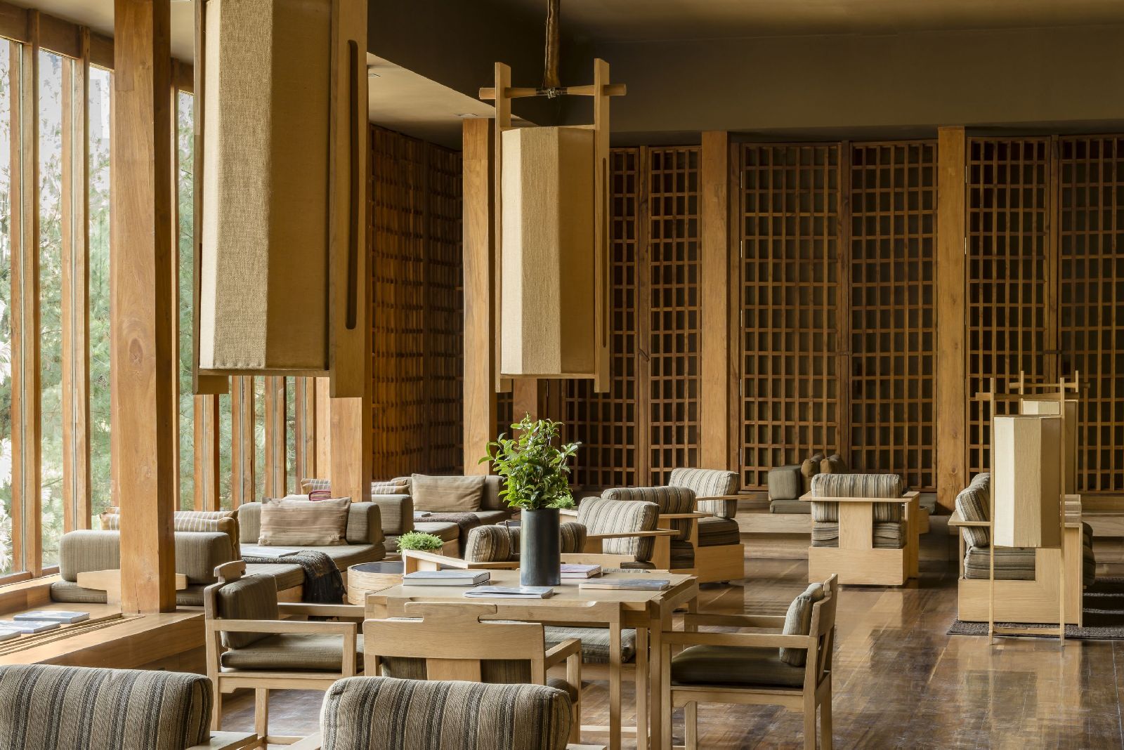 Natural wood ascents fill the minimalistic style living room area at luxury hotel Amankora Paro in Bhutan