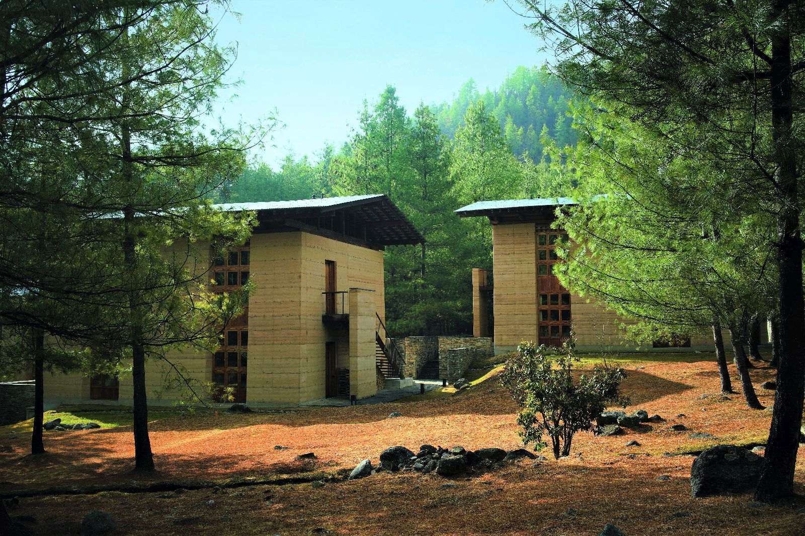 Forest exterior view of suites at luxury hotel Amankora Paro in Bhutan