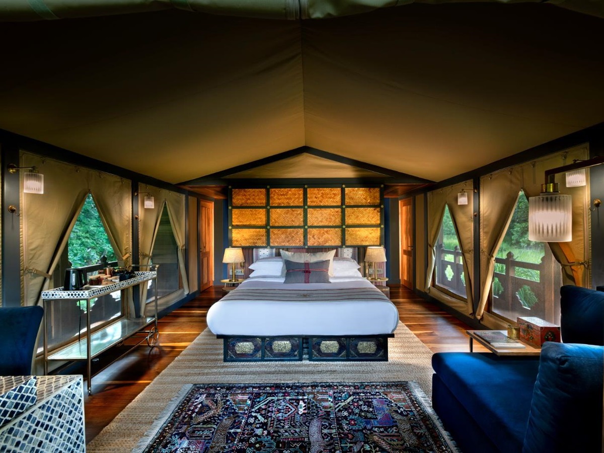 Tented suite bed at &Beyond Punakha River Lodge in Bhutan