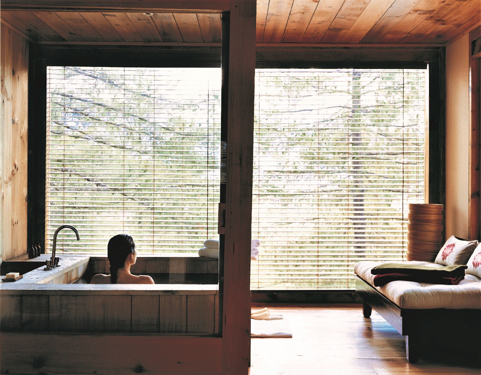 Guest enjoying a hot stone bath at COMO Uma Punakha in Bhutan