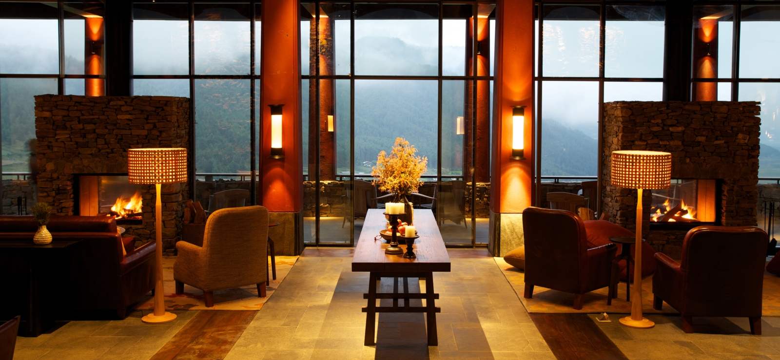 Sitting room at night with misty mountain background