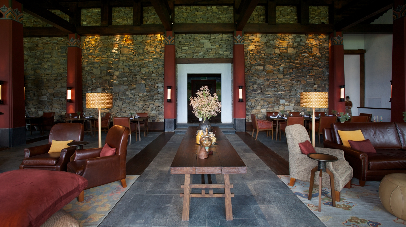 Sitting room with red sofas and wooden furniture