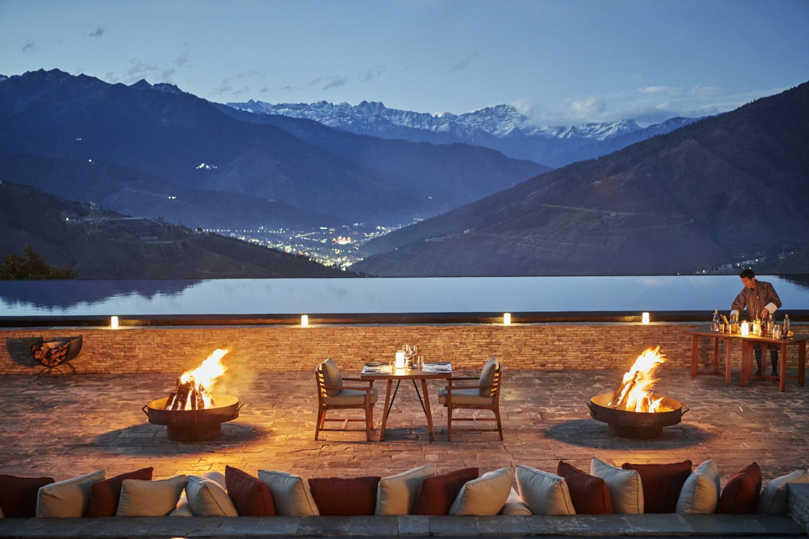 Private courtyard dinner next to the Reflecting Pool at luxury hotel Six Senses Thimpu Lodge in Bhutan