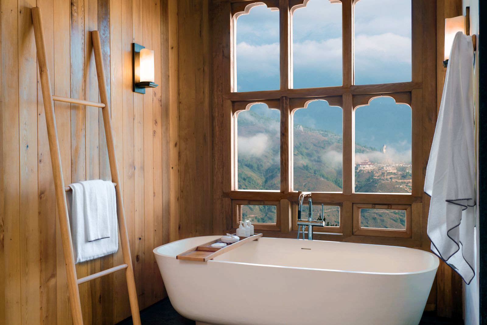 Bathroom with bath and views of the mountains  at Six Senses Thimpu