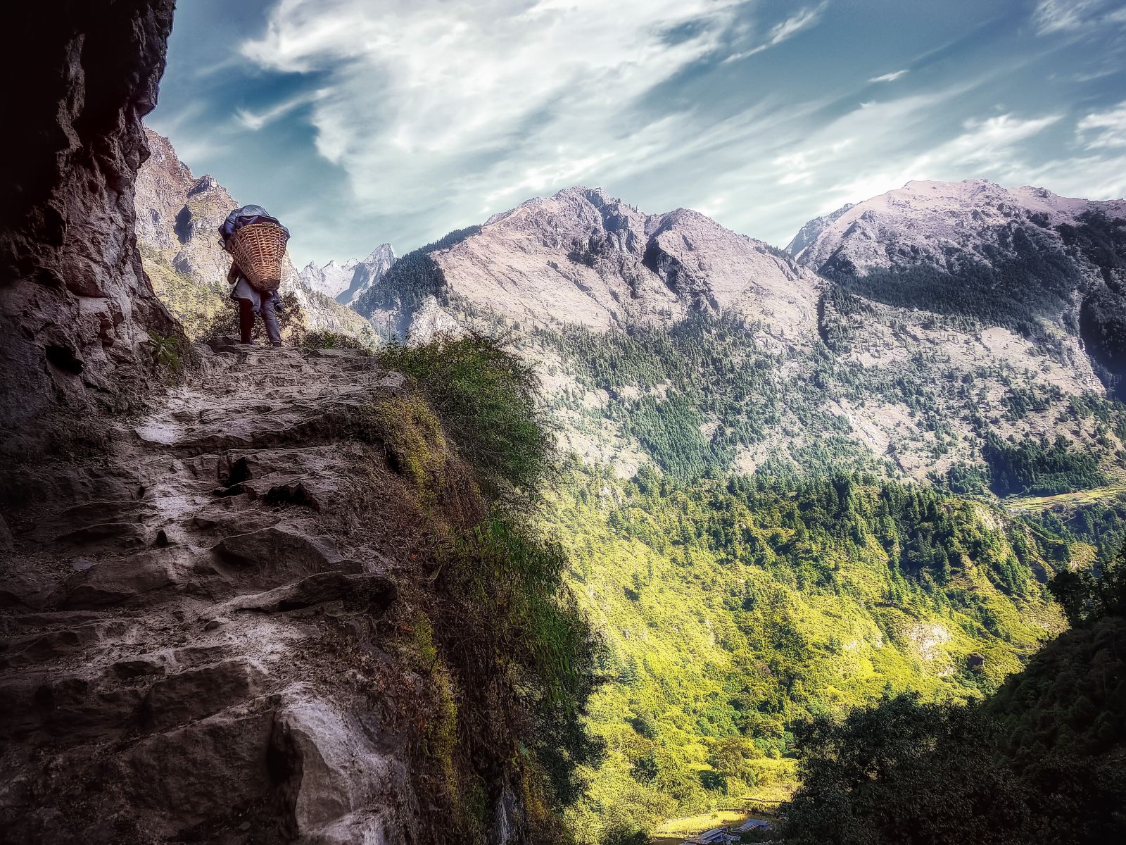 Man ascending a high mountain pass in Bhutan