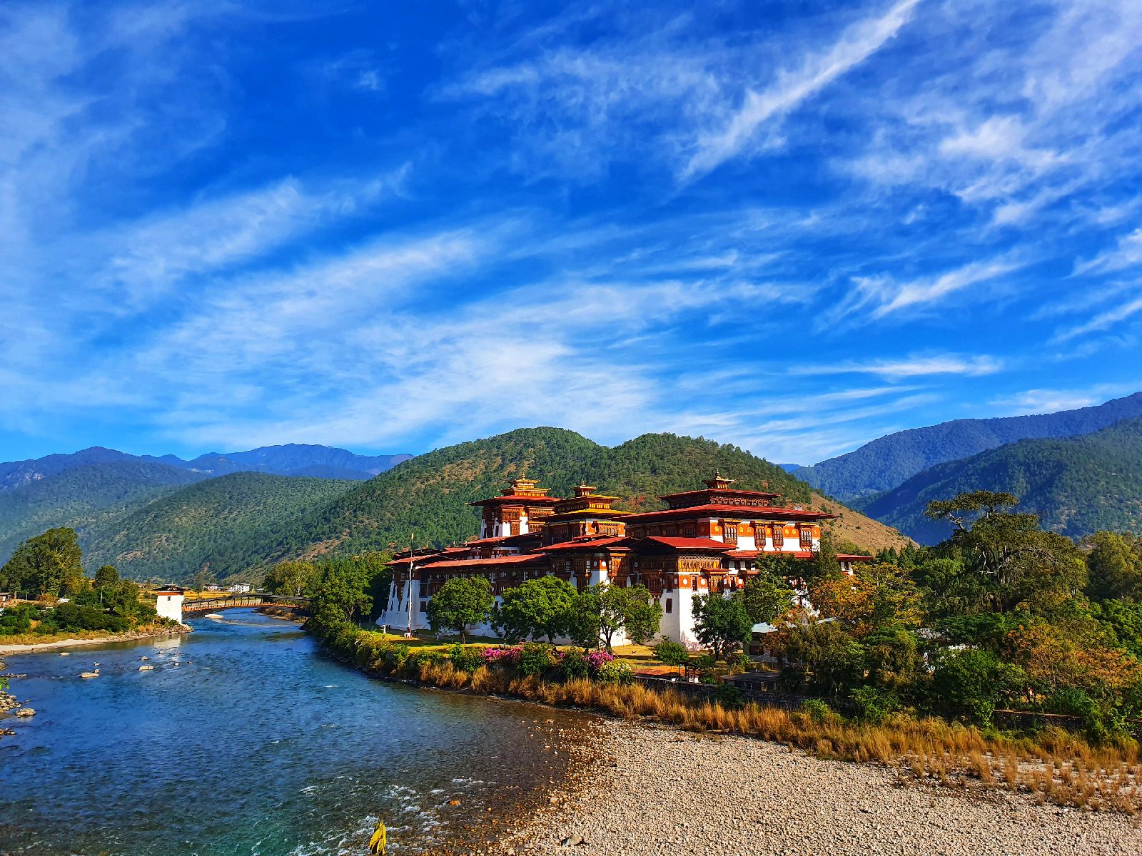 View of the Punakha Dzong from a stage of the Trans-Bhutan Trail