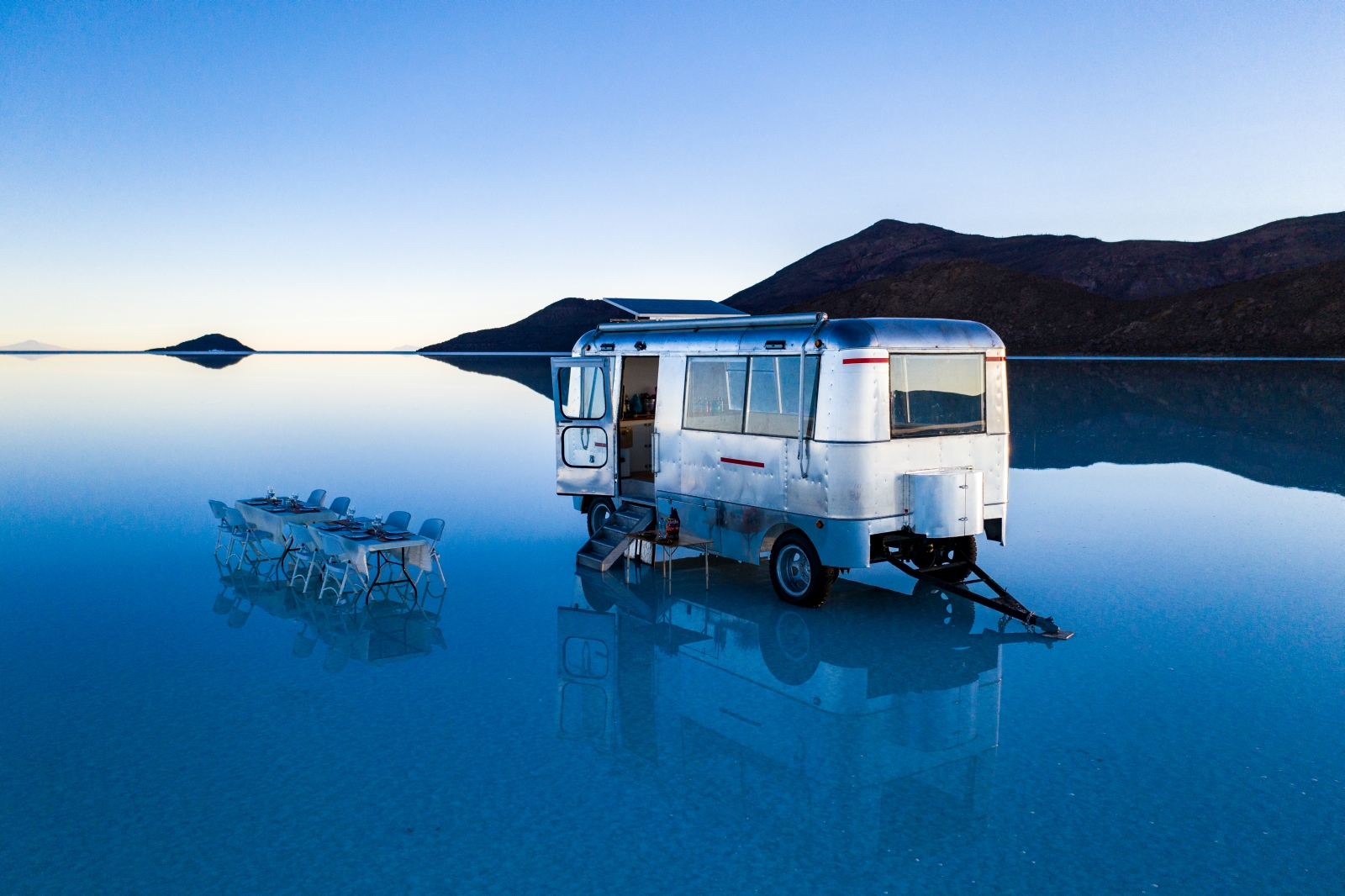 Single vanof Deluxe Airstream Camper in Bolivia Salt Flats