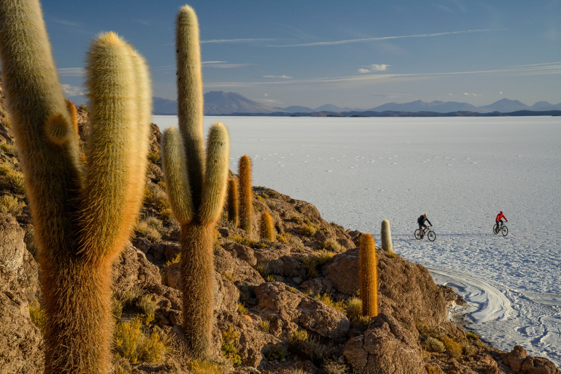 Guests on the Explora Travesia cycling around Fish Island on the Salar de Uyuni, Bolivia