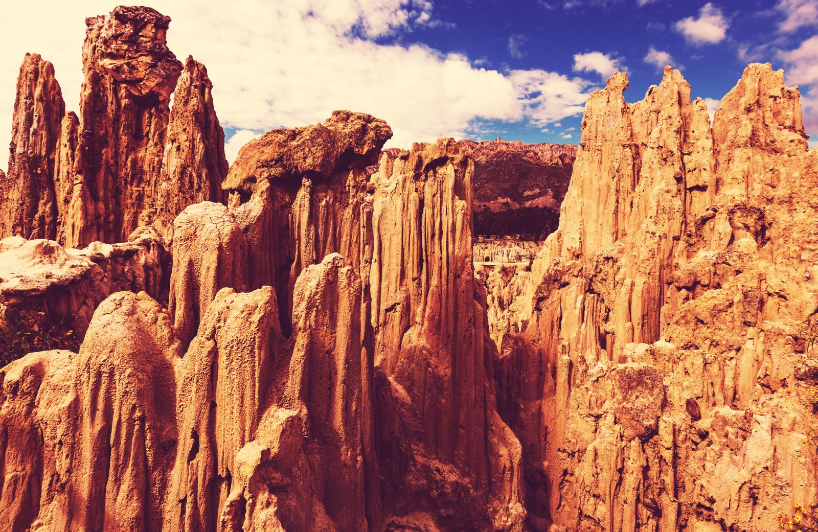 Golden rock formations in Moon Valley in Bolivia