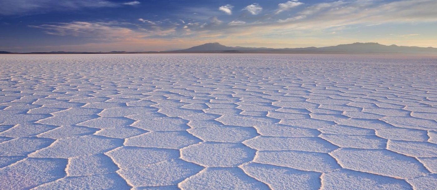 A wide expanse of sections of white salt in the Uyuni salt flats in Bolivia