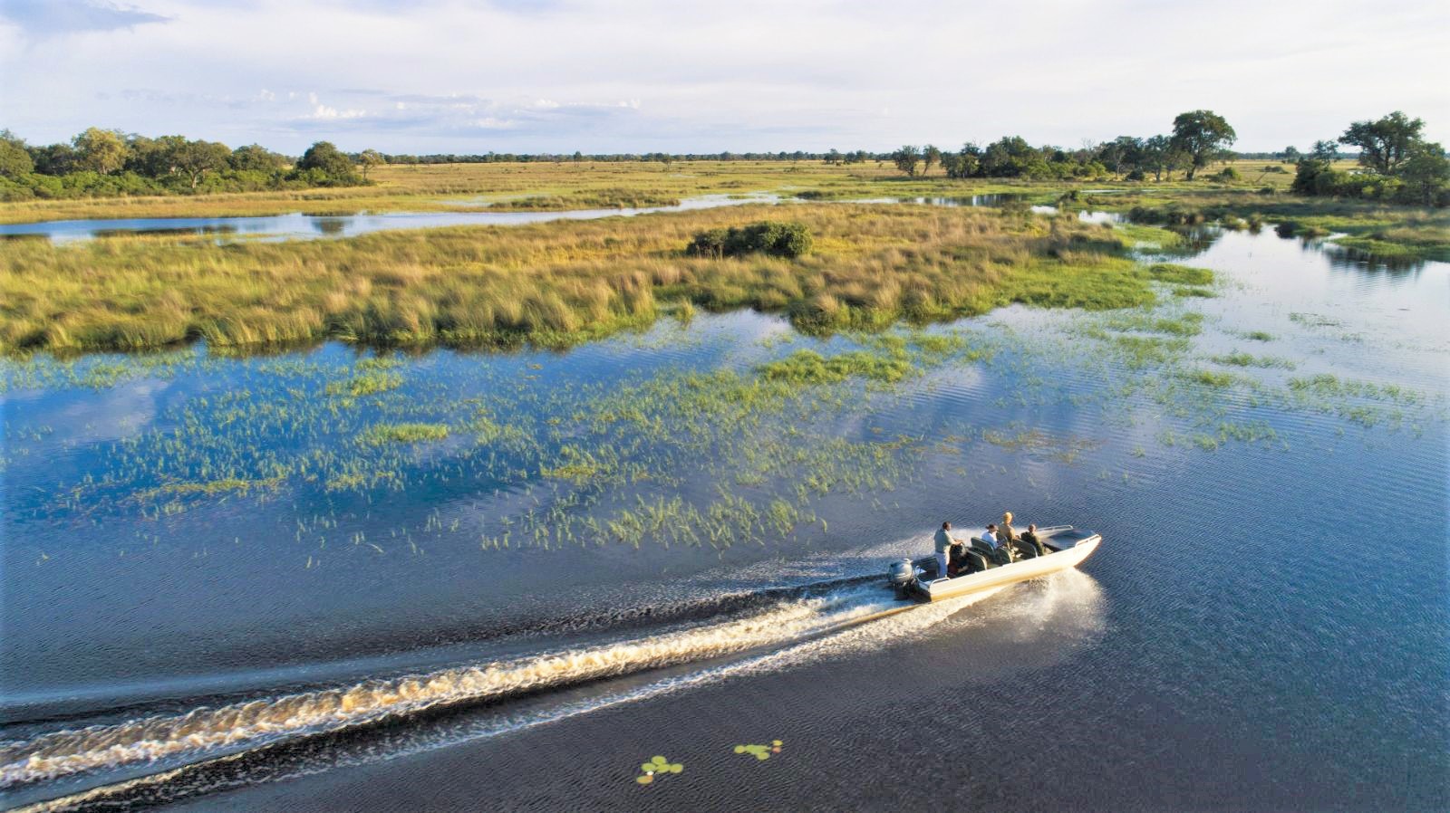 Boat safari on the grounds of Duke's Camp on the Okavango Delta in Botswana