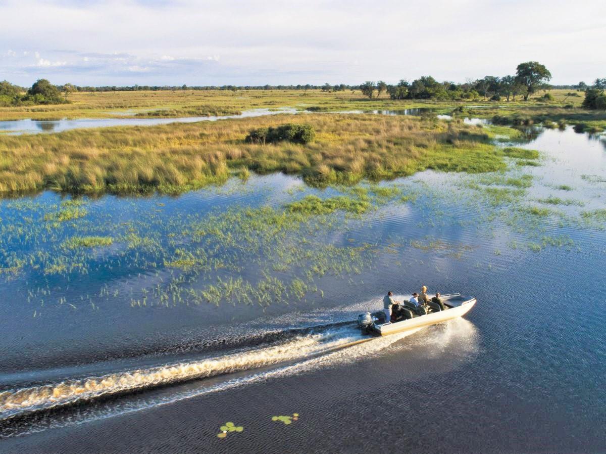 Boat safari on the grounds of Duke's Camp on the Okavango Delta in Botswana