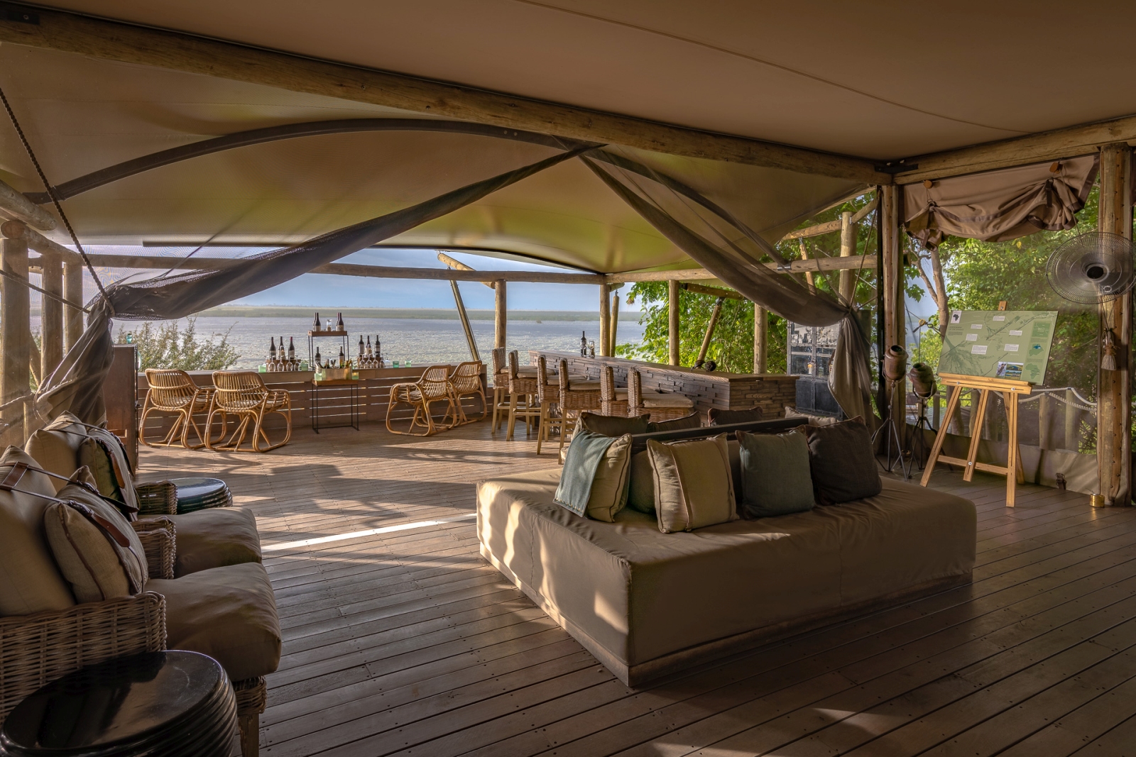 Lounge and bar area of DumaTau with stunning views over the Okavango