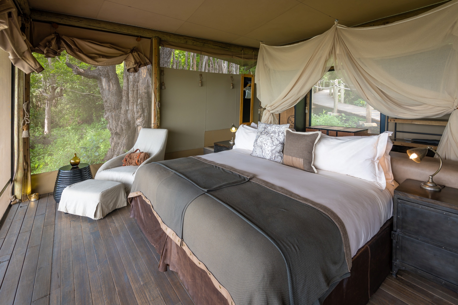 Comfortable double bedroom tent at DumaTau, a luxury safari camp in Botswana's Okavango Delta