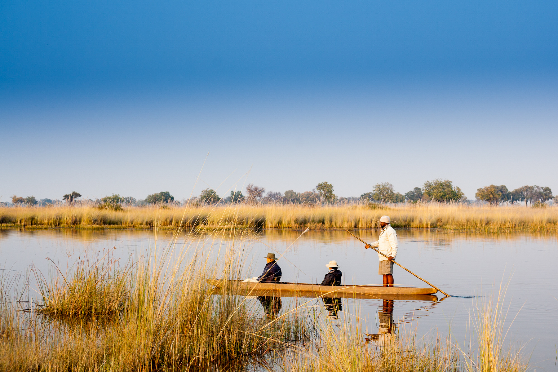A canoe ride along the floodplains from Kwando Splash Camp in the Okavango Delta
