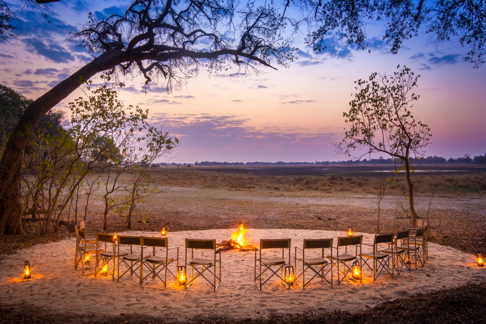 Enjoying the view over the plains at sunset around the campfire