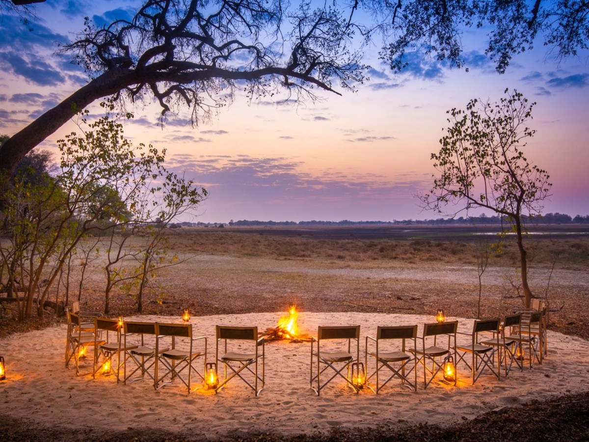 Enjoying the view over the plains at sunset around the campfire
