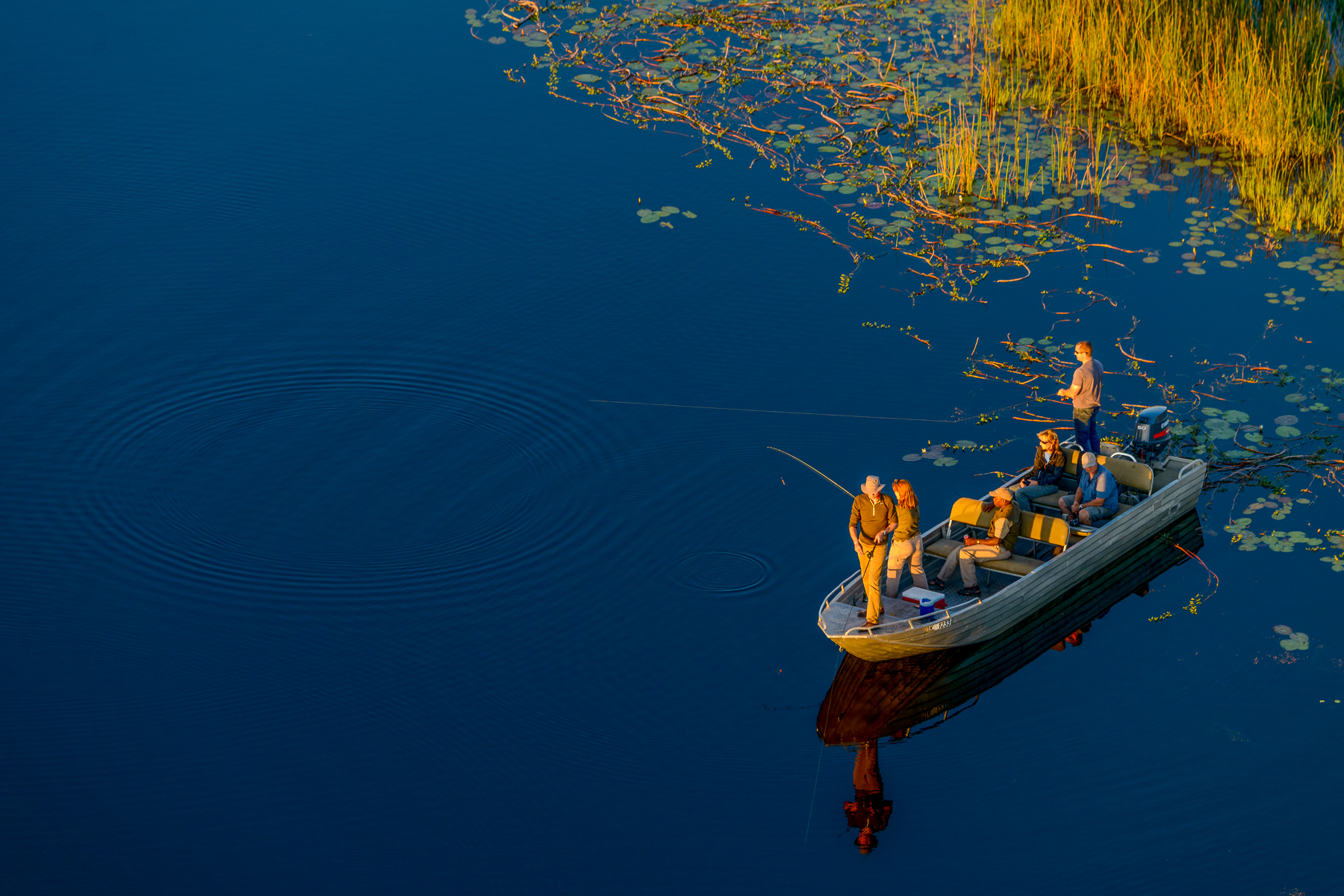 Fishing during a boat safari in the Okavango Delta from Macatoo Camp