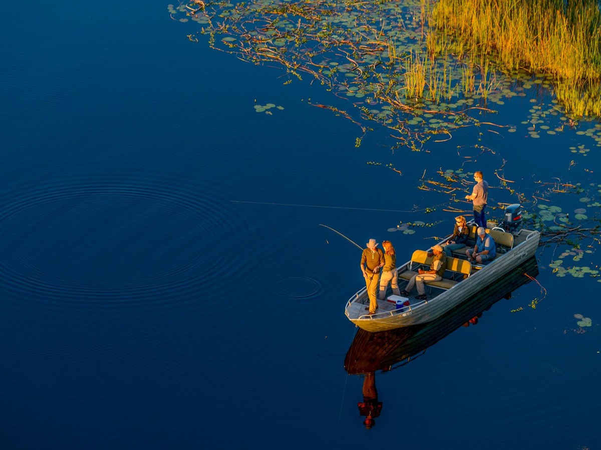 Fishing during a boat safari in the Okavango Delta from Macatoo Camp