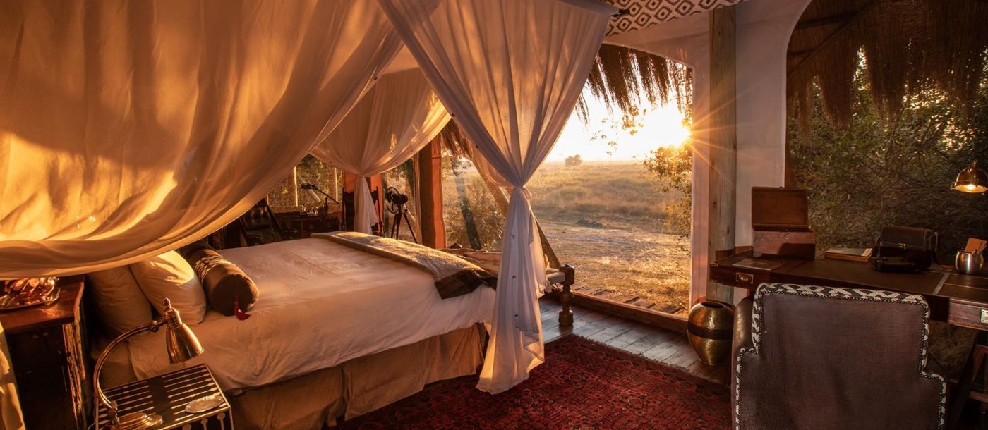 Guest suite bed at Selinda Camp in the Selinda Reserve in Botswana