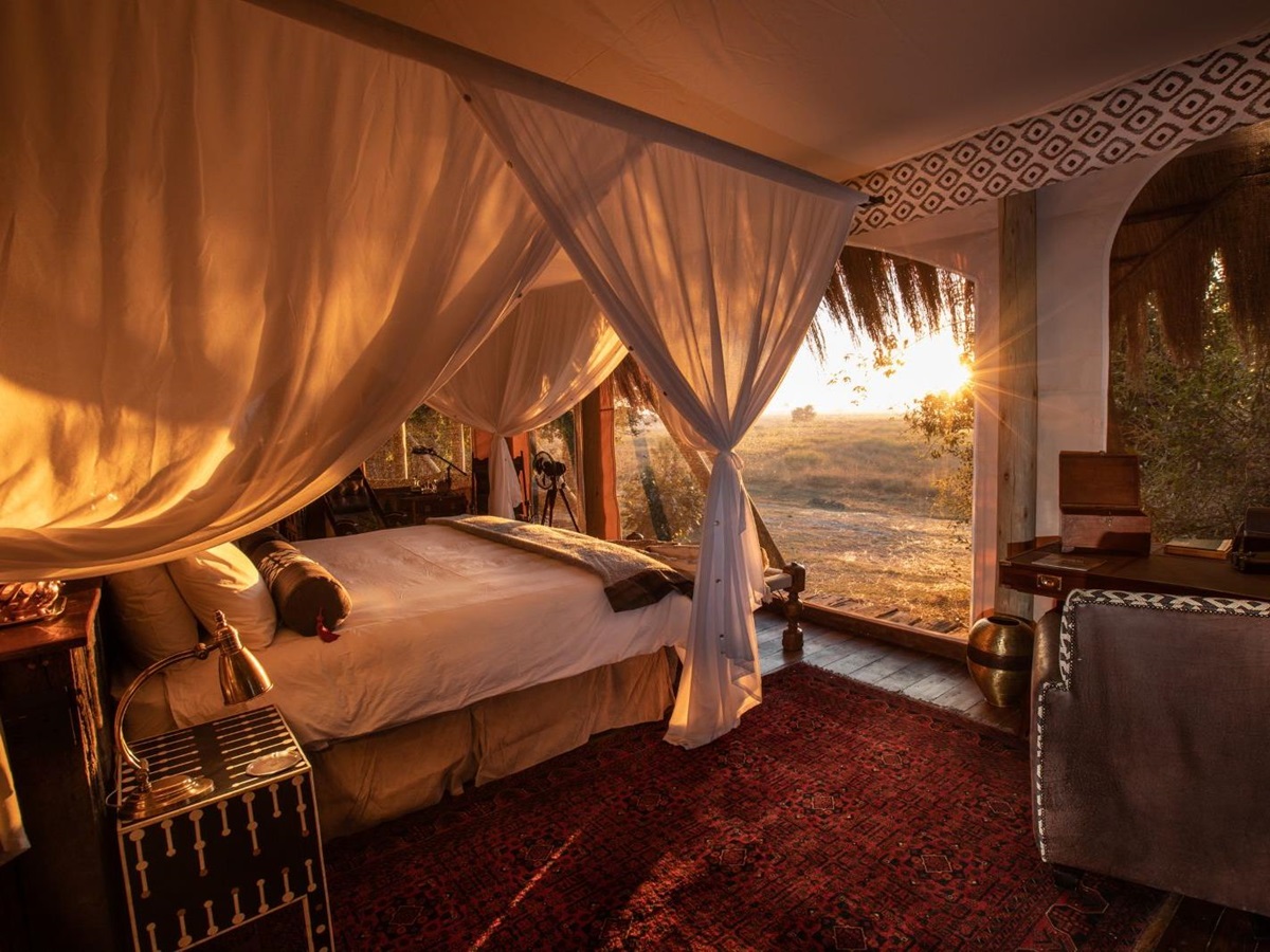 Guest suite bed at Selinda Camp in the Selinda Reserve in Botswana