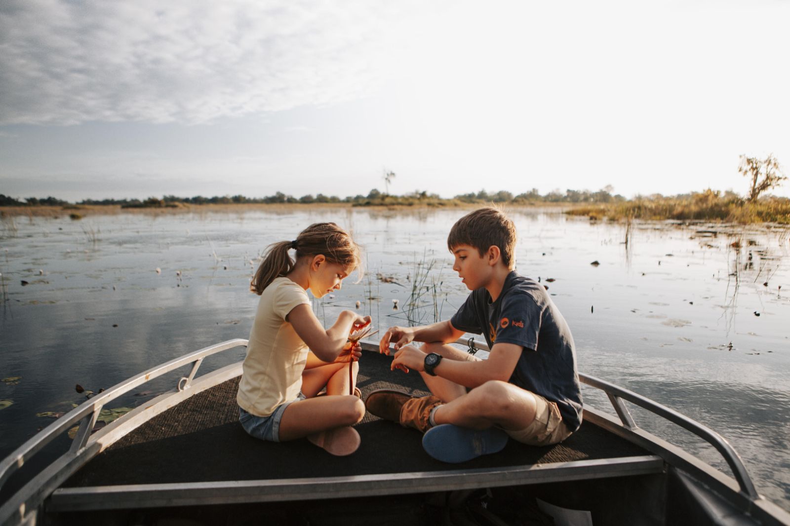 A family on a river safari from Vumbura Plains in Botswana's Okavango Delta
