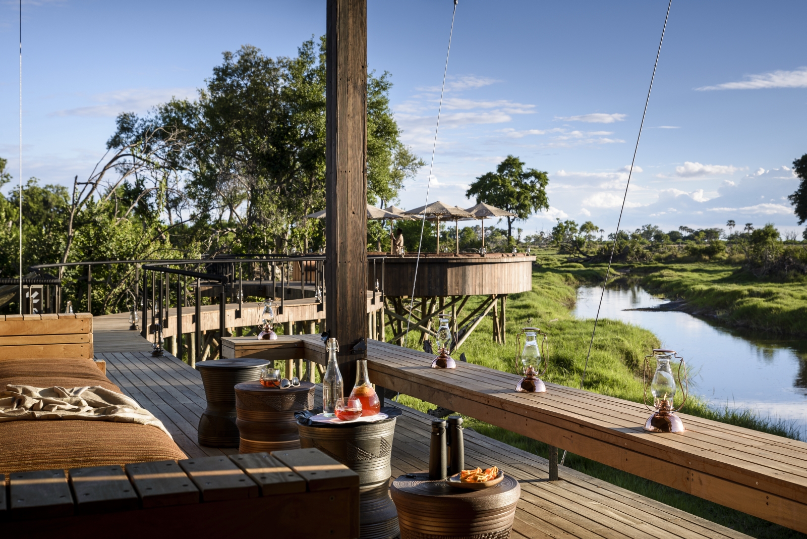 View from the mai ndeck with seating over the waterways and surroundings of the Okavango Delta at Xigera Safari Camp
