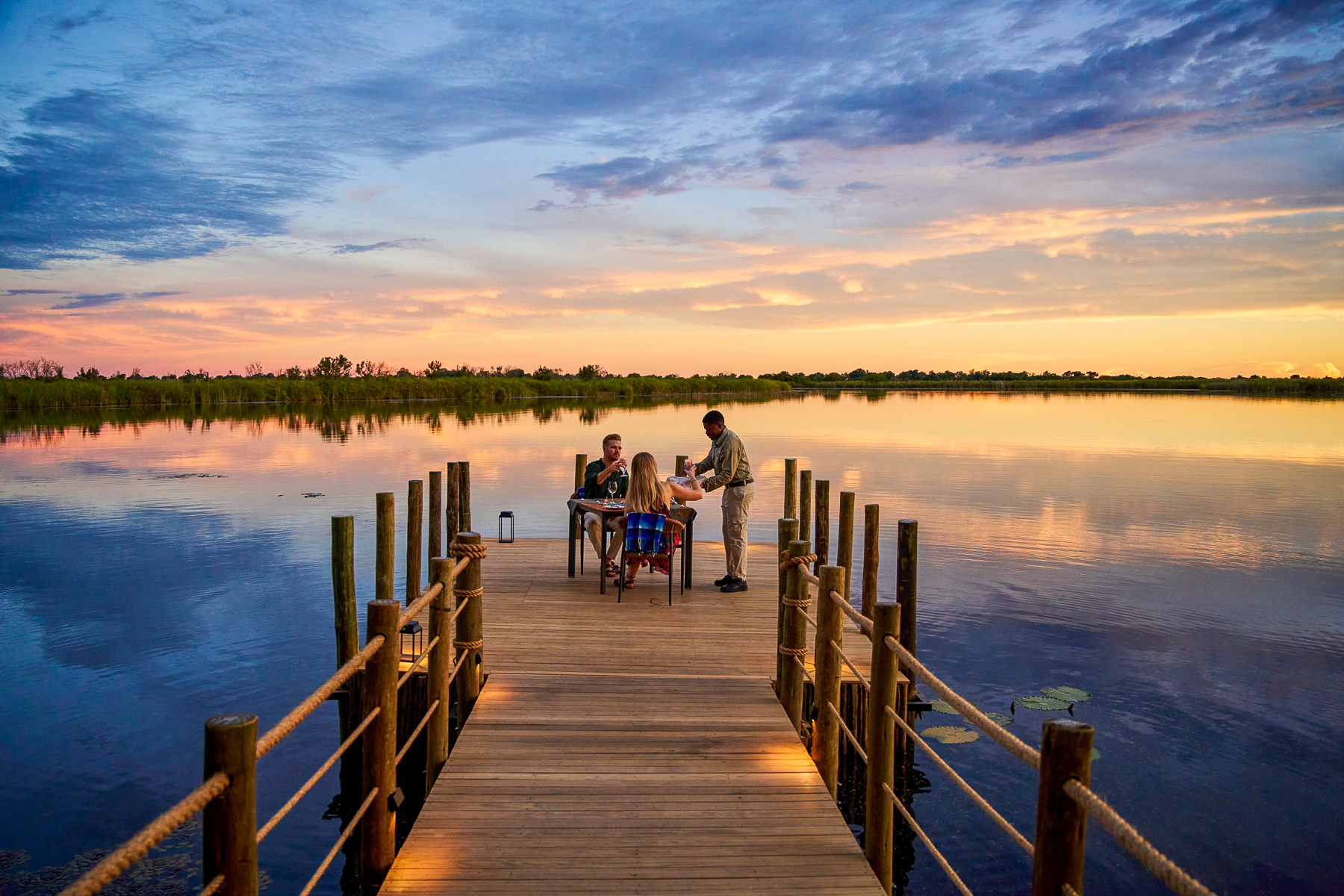 Private dining on a pier over the lagoon from Xugana Island Lodge in the Okavango Delta
