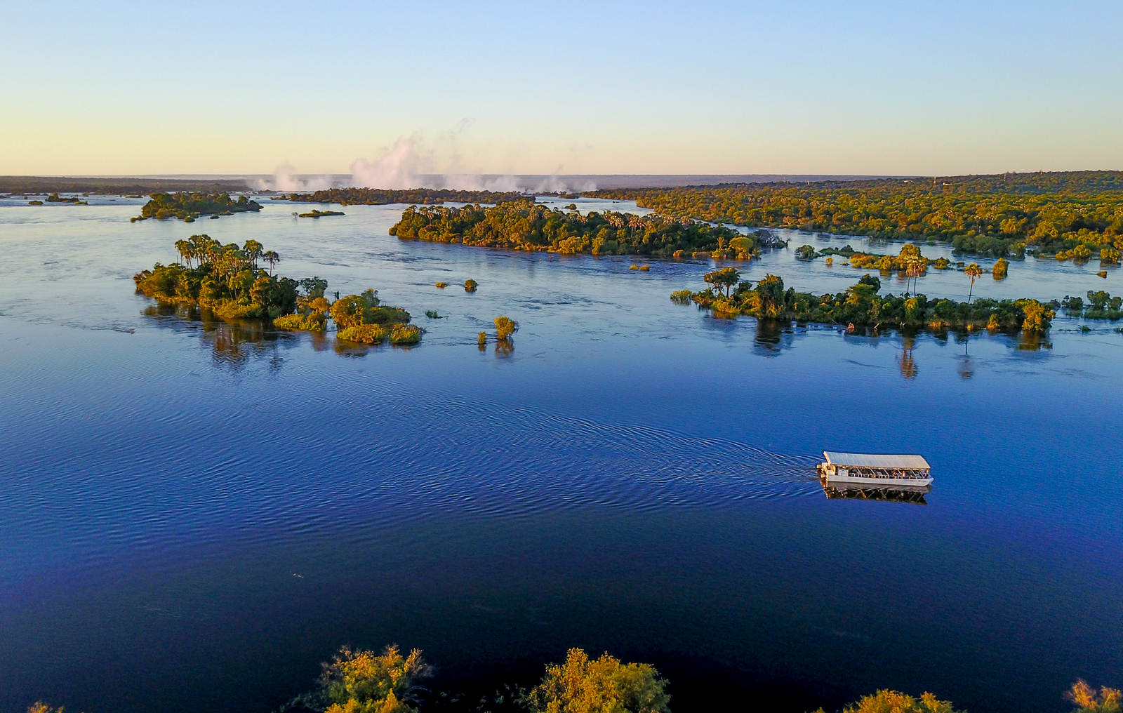 Guests of the Elephant Camp cruising the Zambezi near the Victoria Falls