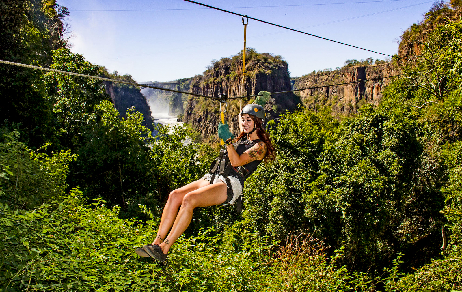 Guests of The Elephant Camp ziplining in the canopies surrounding the Victoria Falls