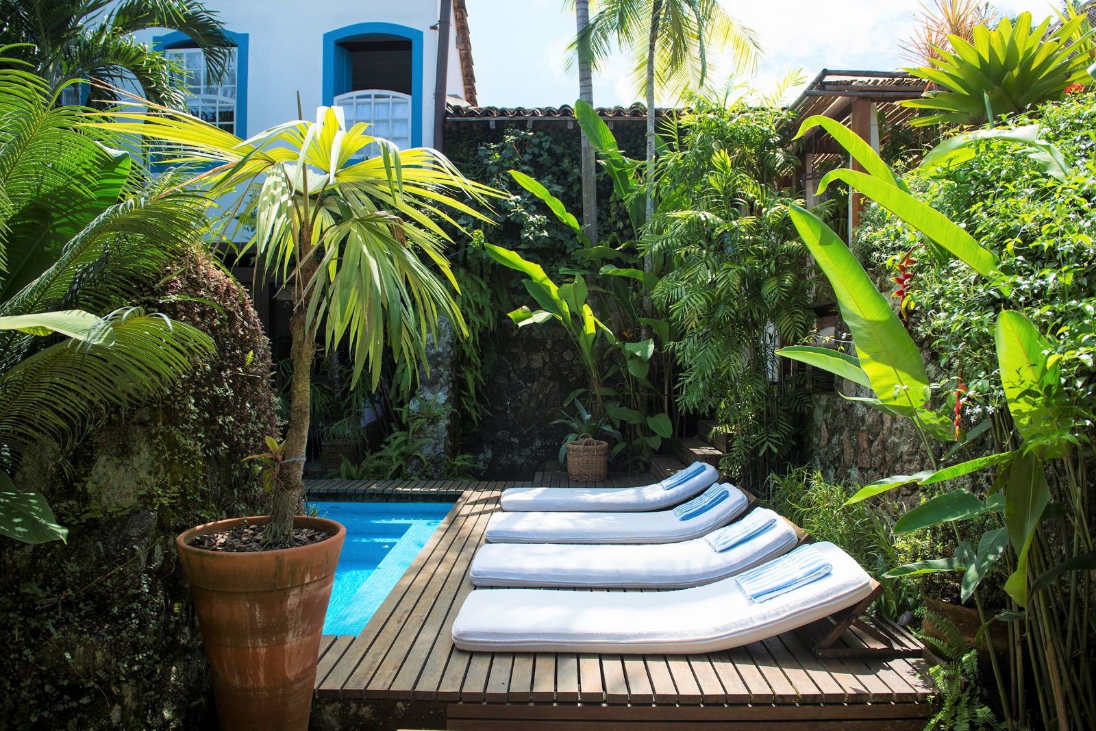 Loungers by the pool at Casa Turquesa in Paraty, Brazil