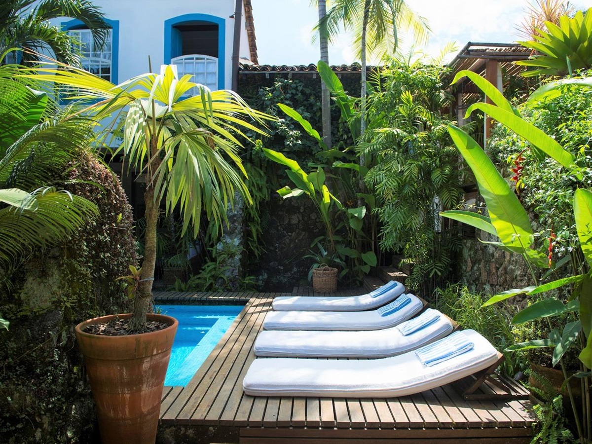 Loungers by the pool at Casa Turquesa in Paraty, Brazil