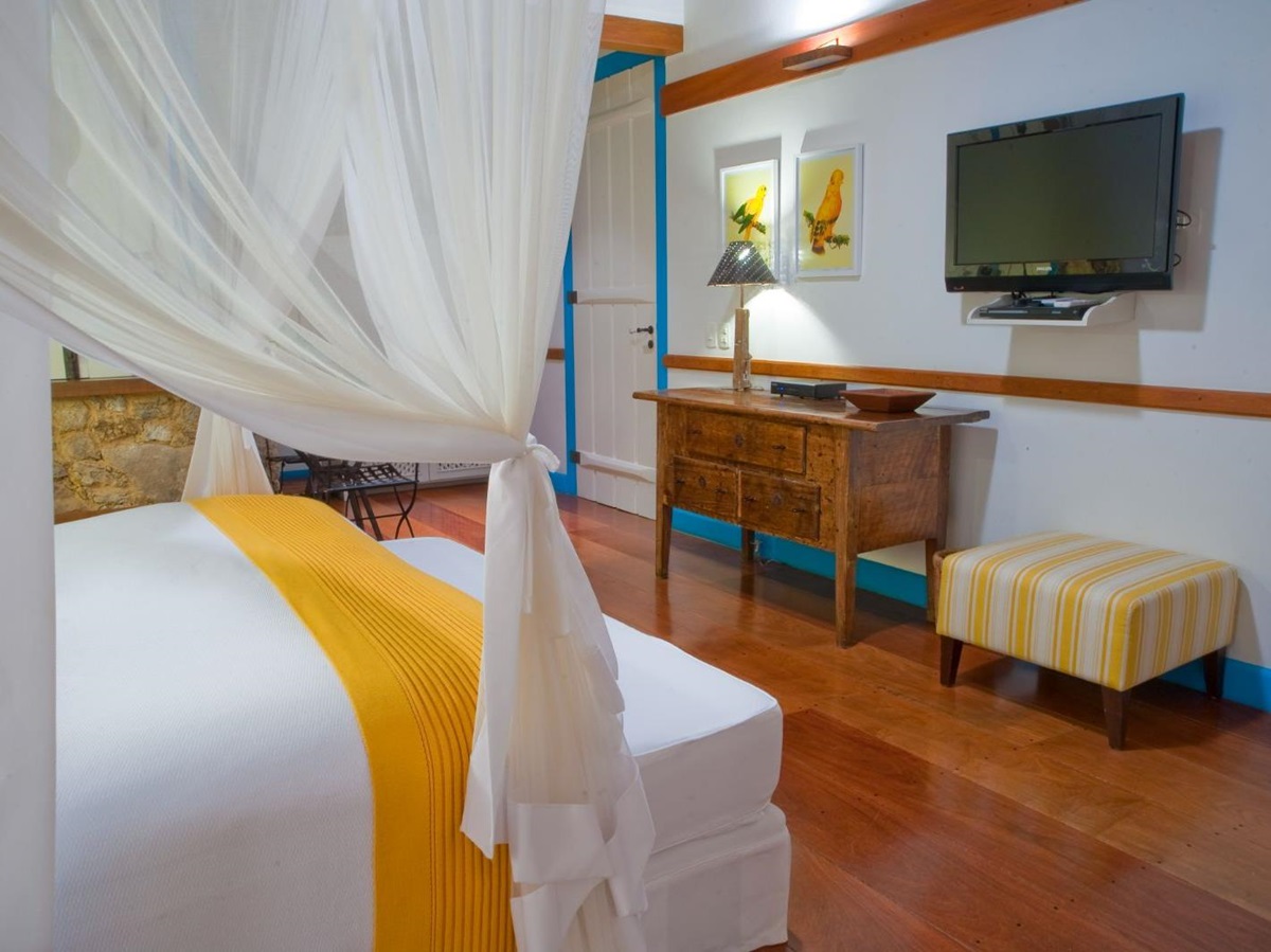 Yellow guest suite at Casa Turquesa in Paraty, Brazil
