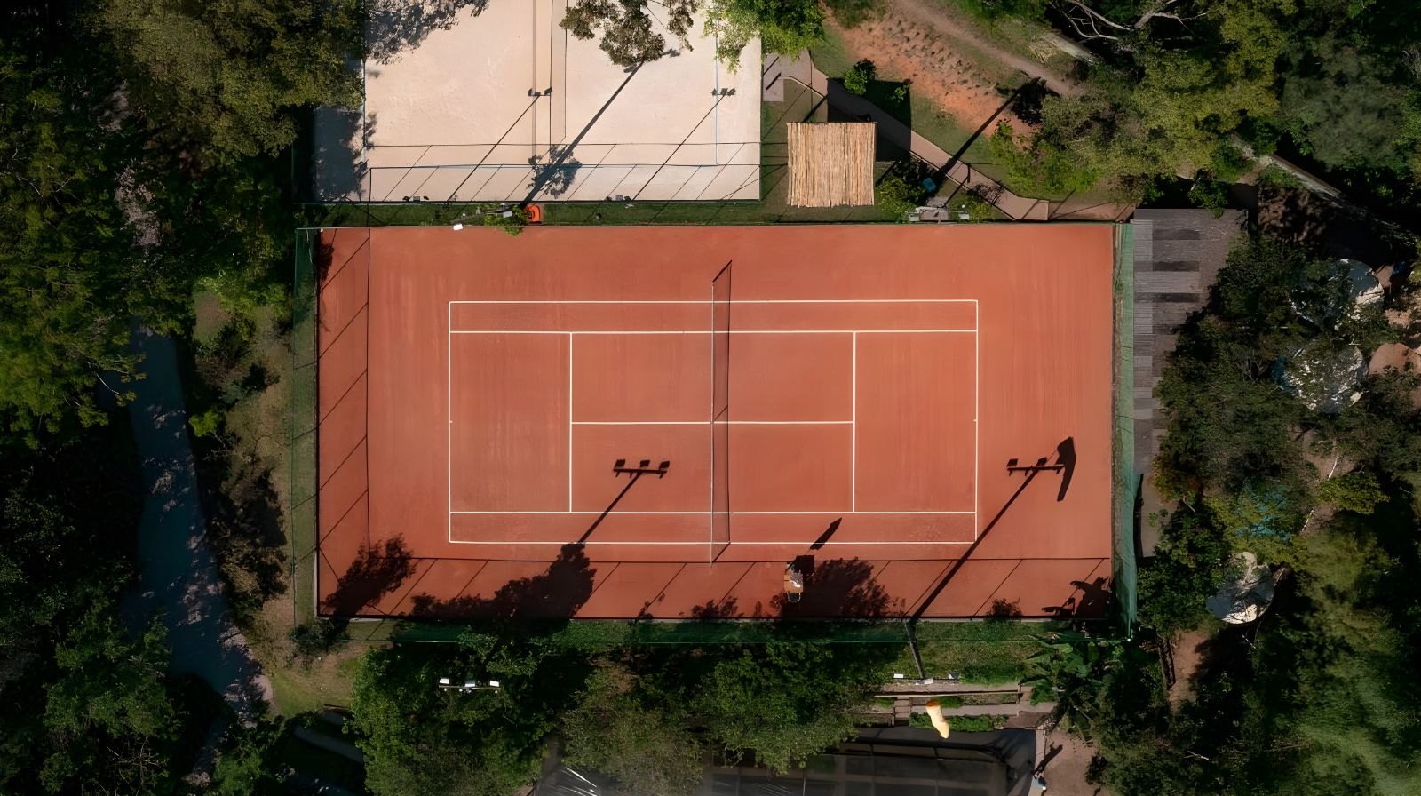 Aerial view of tennis courts at Ponta Dos Ganchos Excusive Resort in Brazil