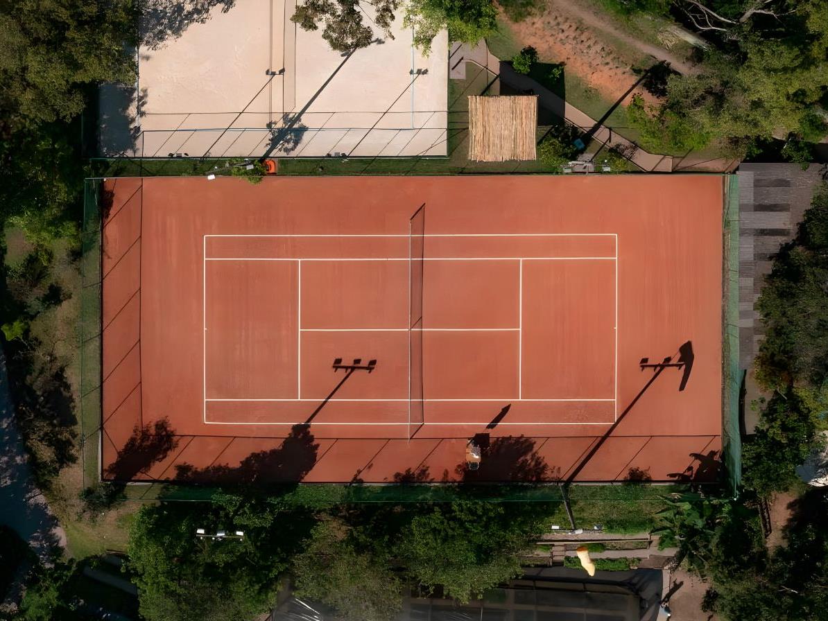 Aerial view of tennis courts at Ponta Dos Ganchos Excusive Resort in Brazil