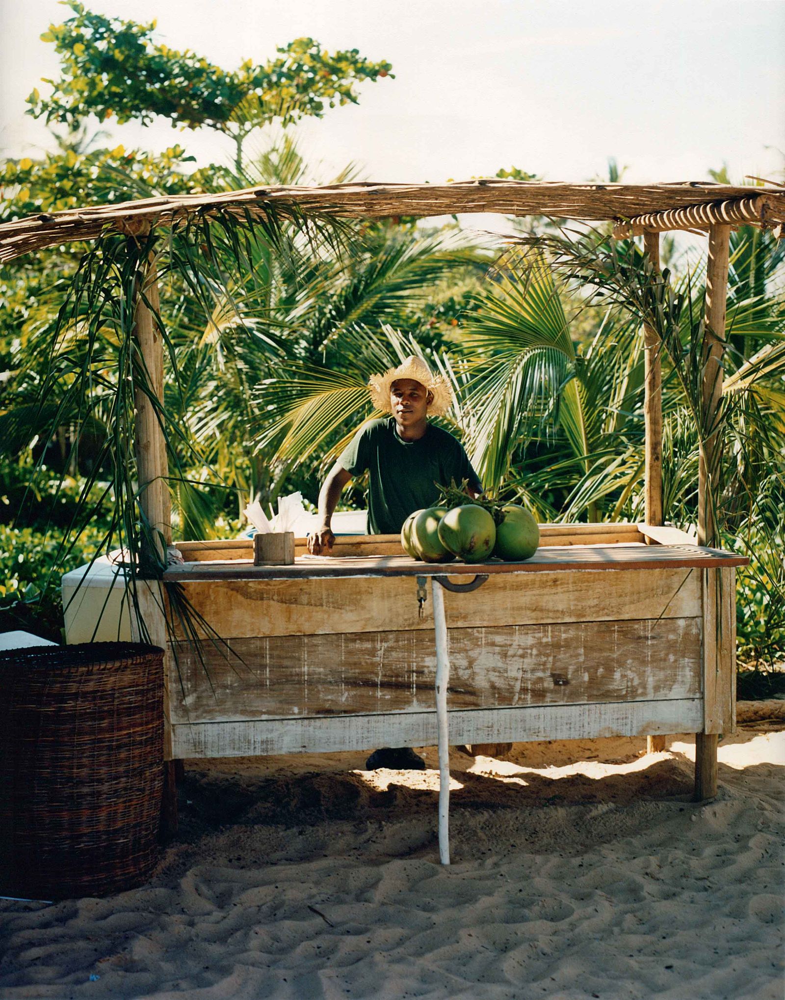 Wooden beach bar with coconut drinks at luxury resort Uxua Casa Hotel and Spa in Brazil