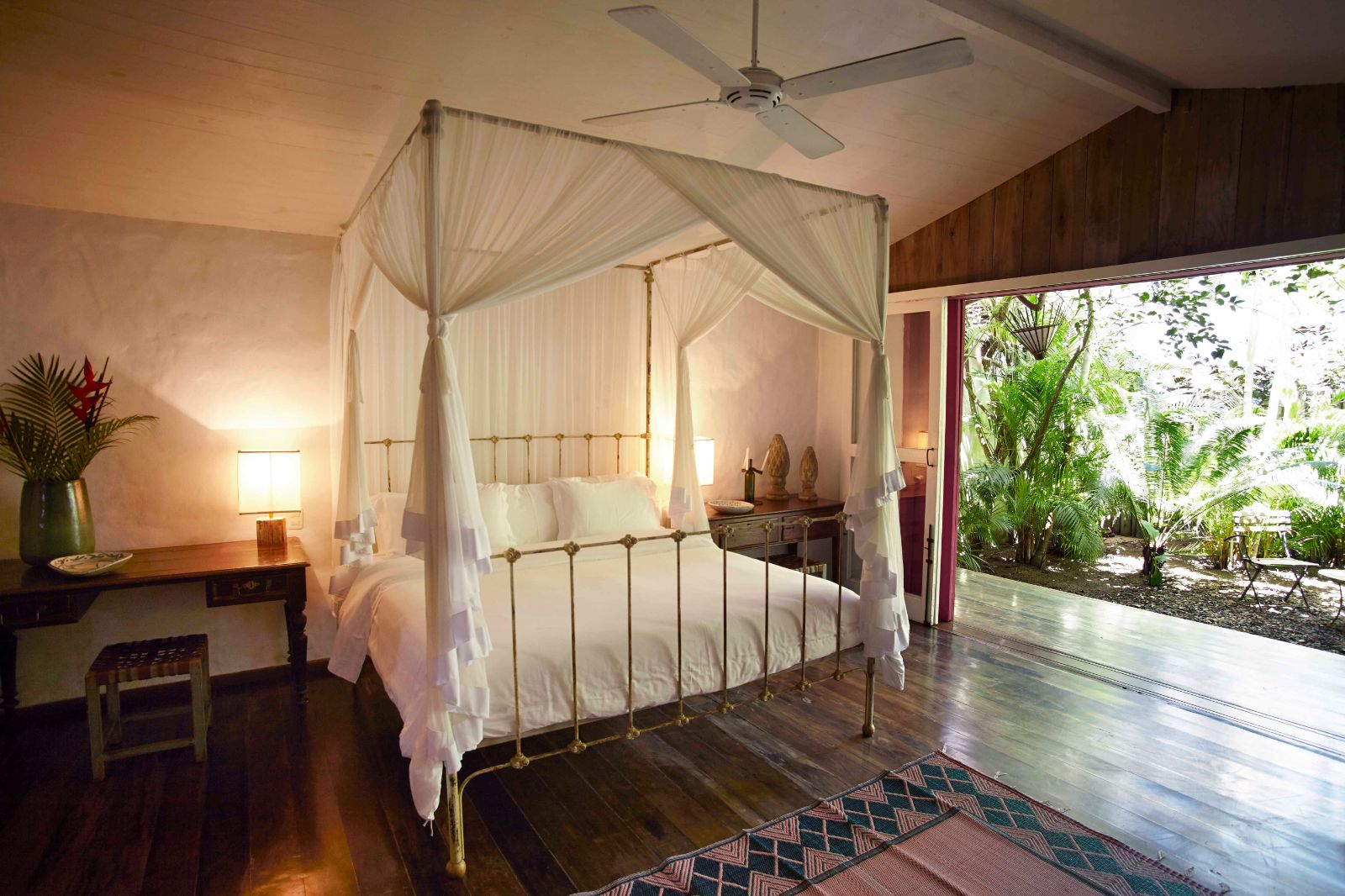 Cosy bedroom with open plan to outdoor pool at luxury resort Uxua Casa Hotel and Spa in Brazil 
