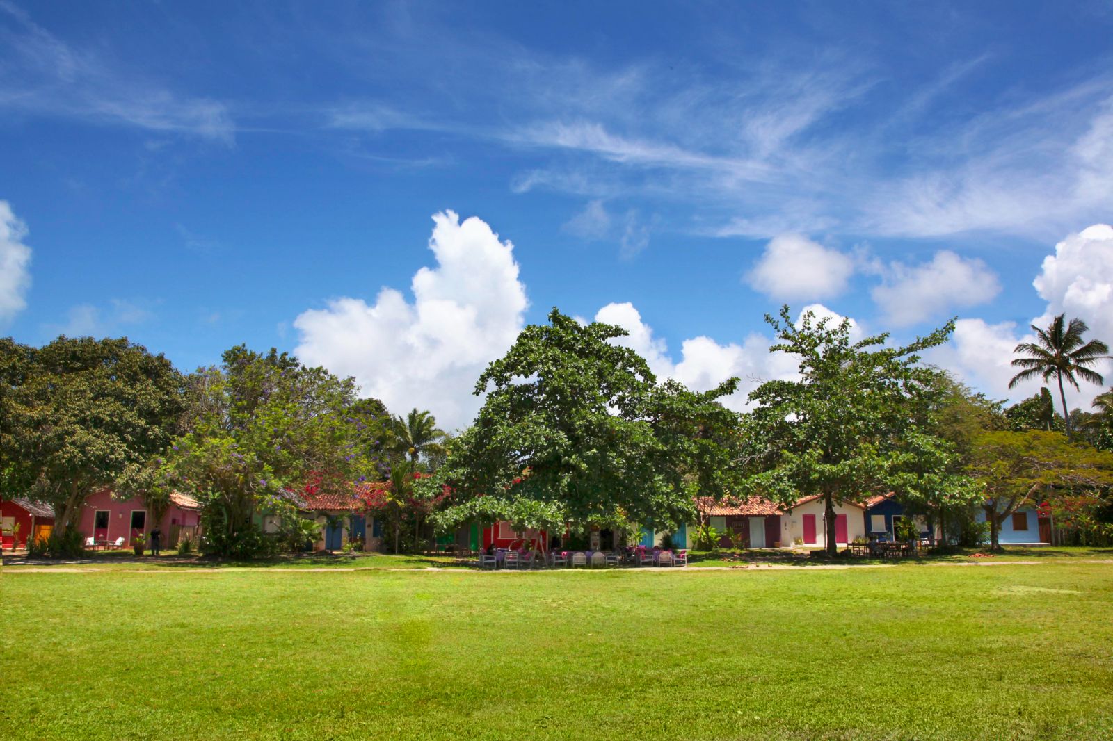 Exterior view of colourful casa accommodation set in thick greenery at luxury resort Uxua Casa Hotel and Spa in Brazil