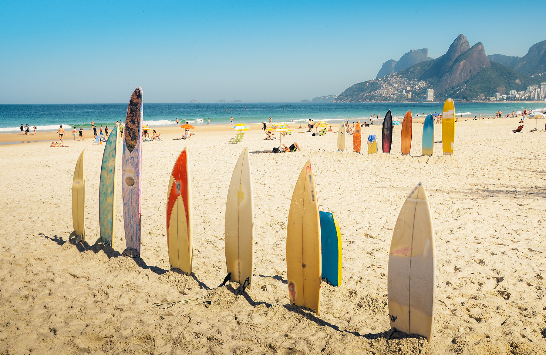 Surfboards lined up along the beach in Rio