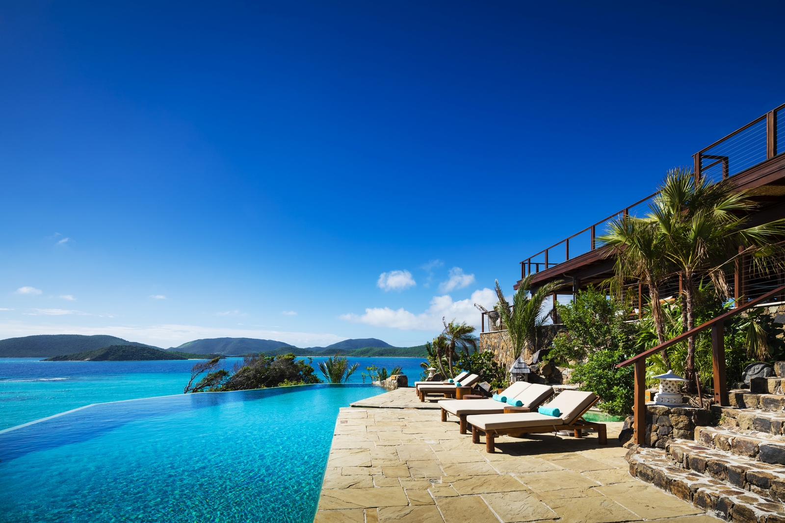 Pool with loungers at The Great House at Necker Island