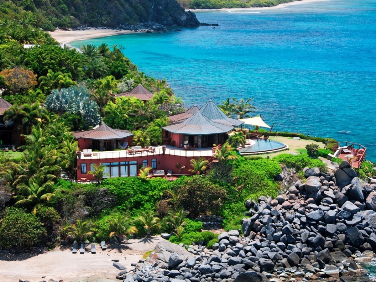 Aerial of the villa with beaches either side