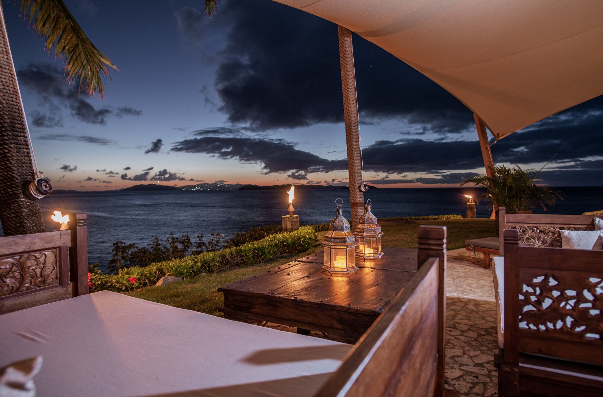 Outdoor seating at night at Baraka Point