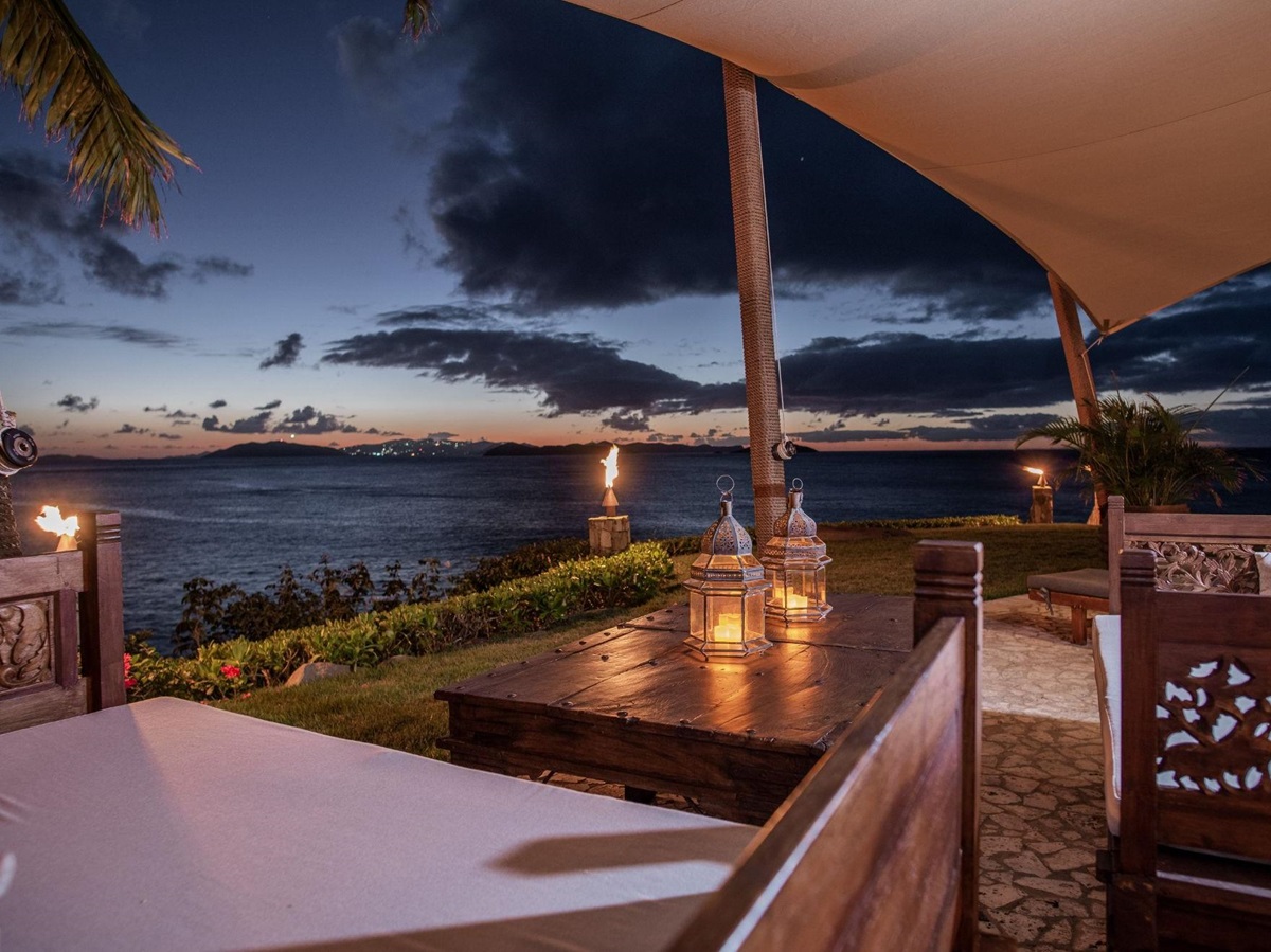 Outdoor seating at night at Baraka Point