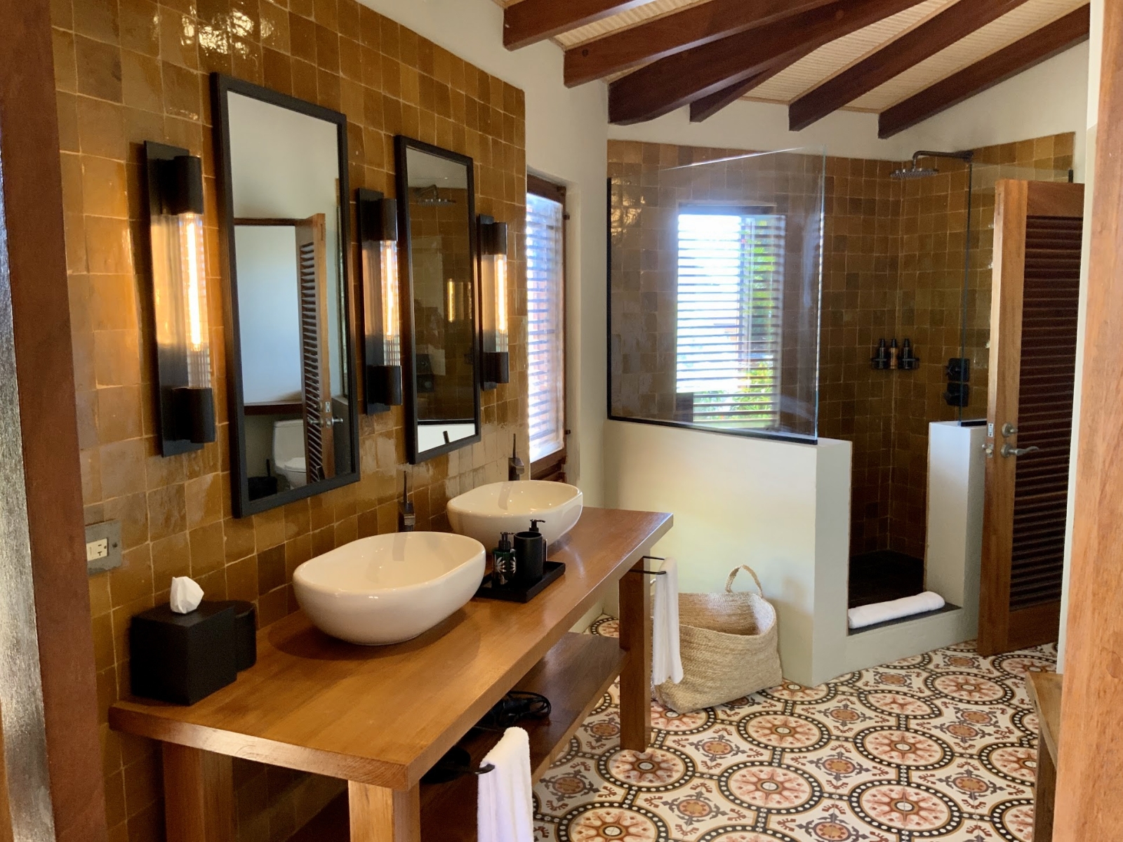 Tiled bathroom with walk in shower and double vanity