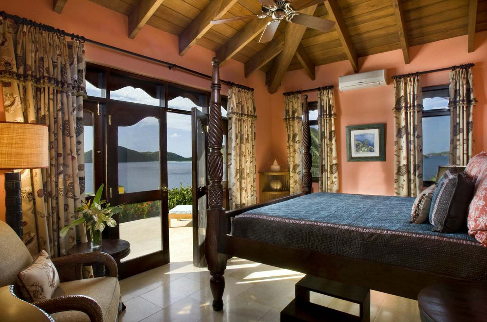 Orange double bedroom of Golden Pavillion, British Virgin Islands