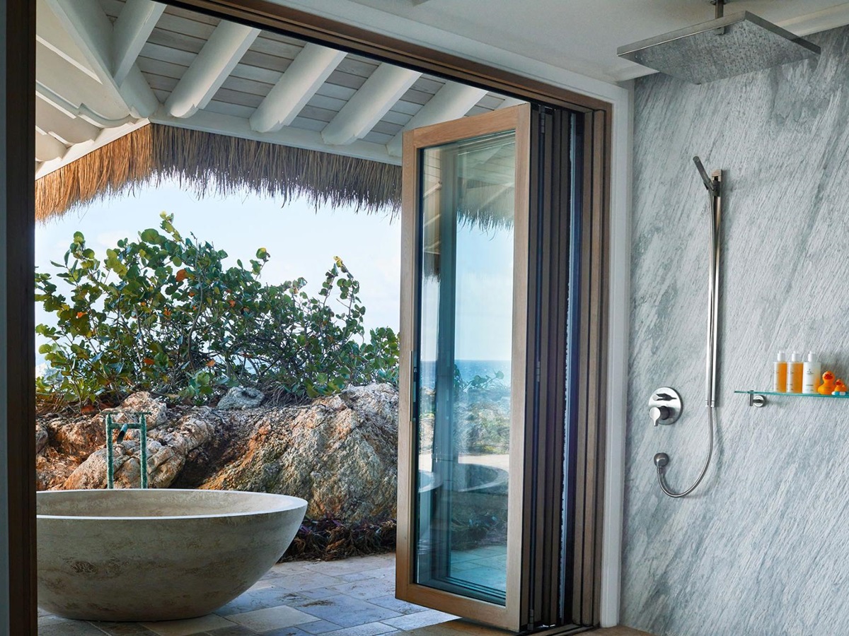 Master bedroom with bath outside at The Branson Estate on Moskito Island in the British Virgin Islands