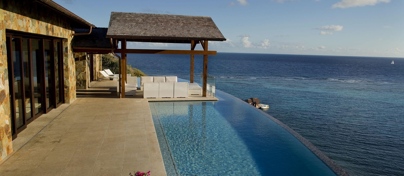 Swimming pool and ocean near Water's Edge Villa, British Virgin Islands