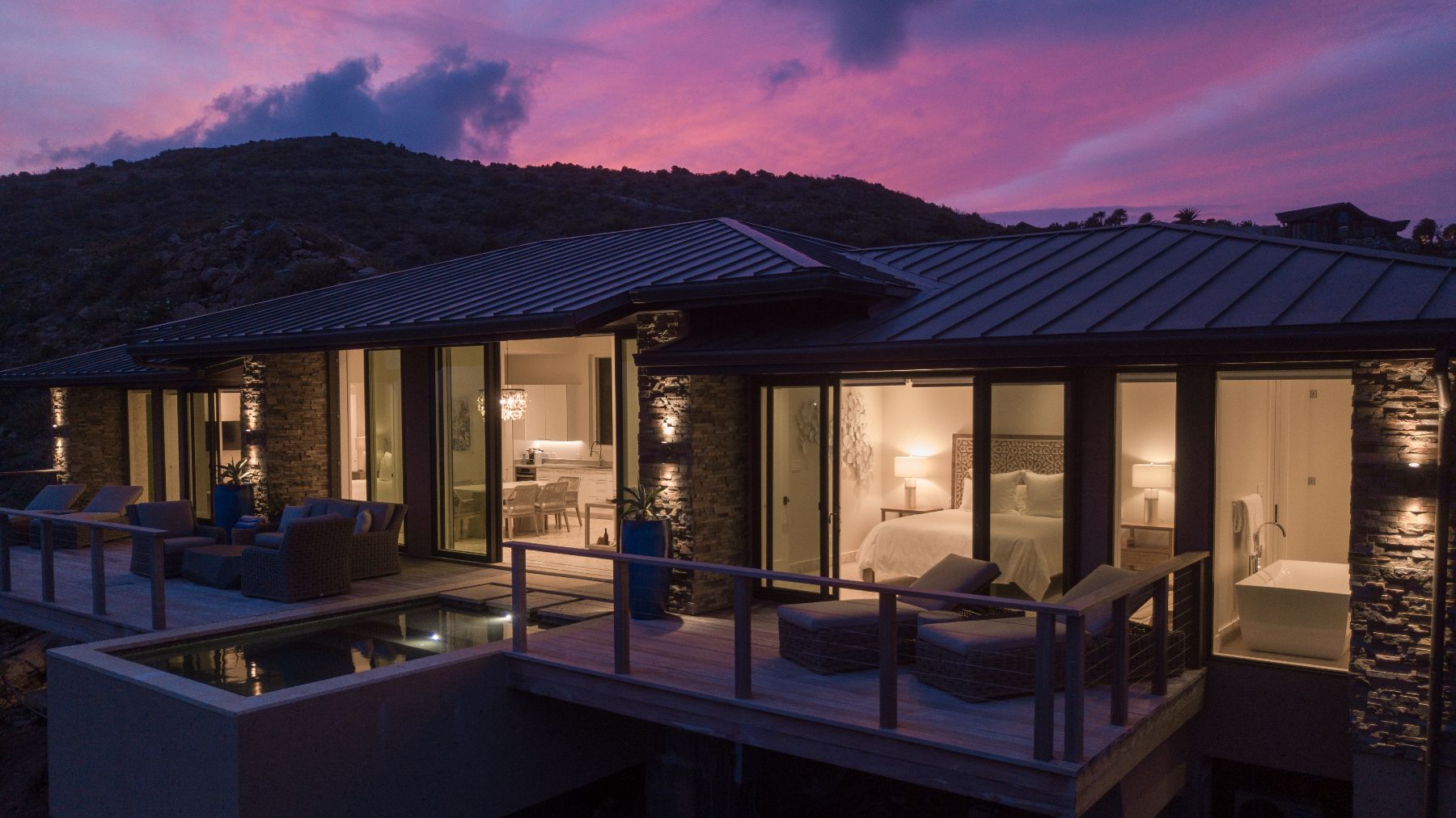 Exterior of villa at night at Whale Point in the Nut Oil Bay Resort in the British Virgin Islands