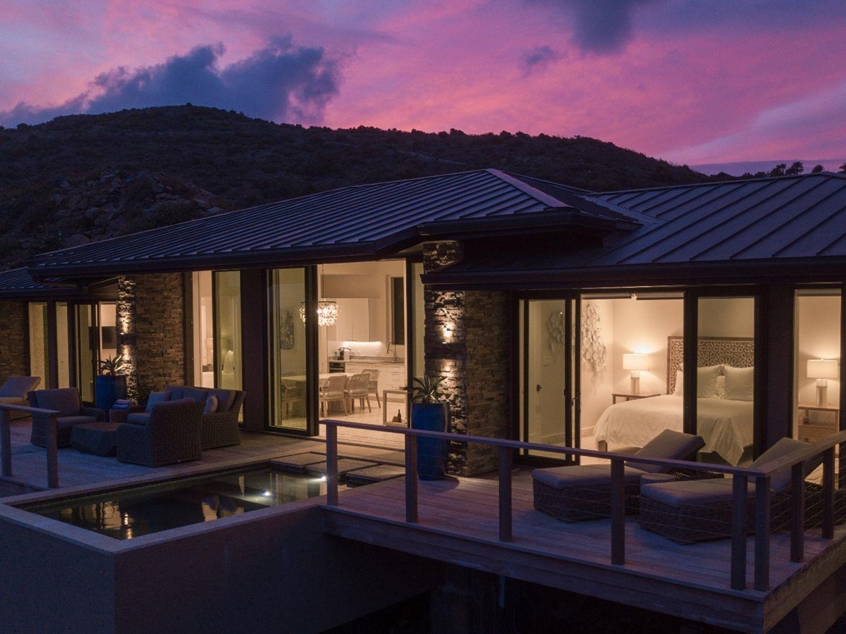 Exterior of villa at night at Whale Point in the Nut Oil Bay Resort in the British Virgin Islands