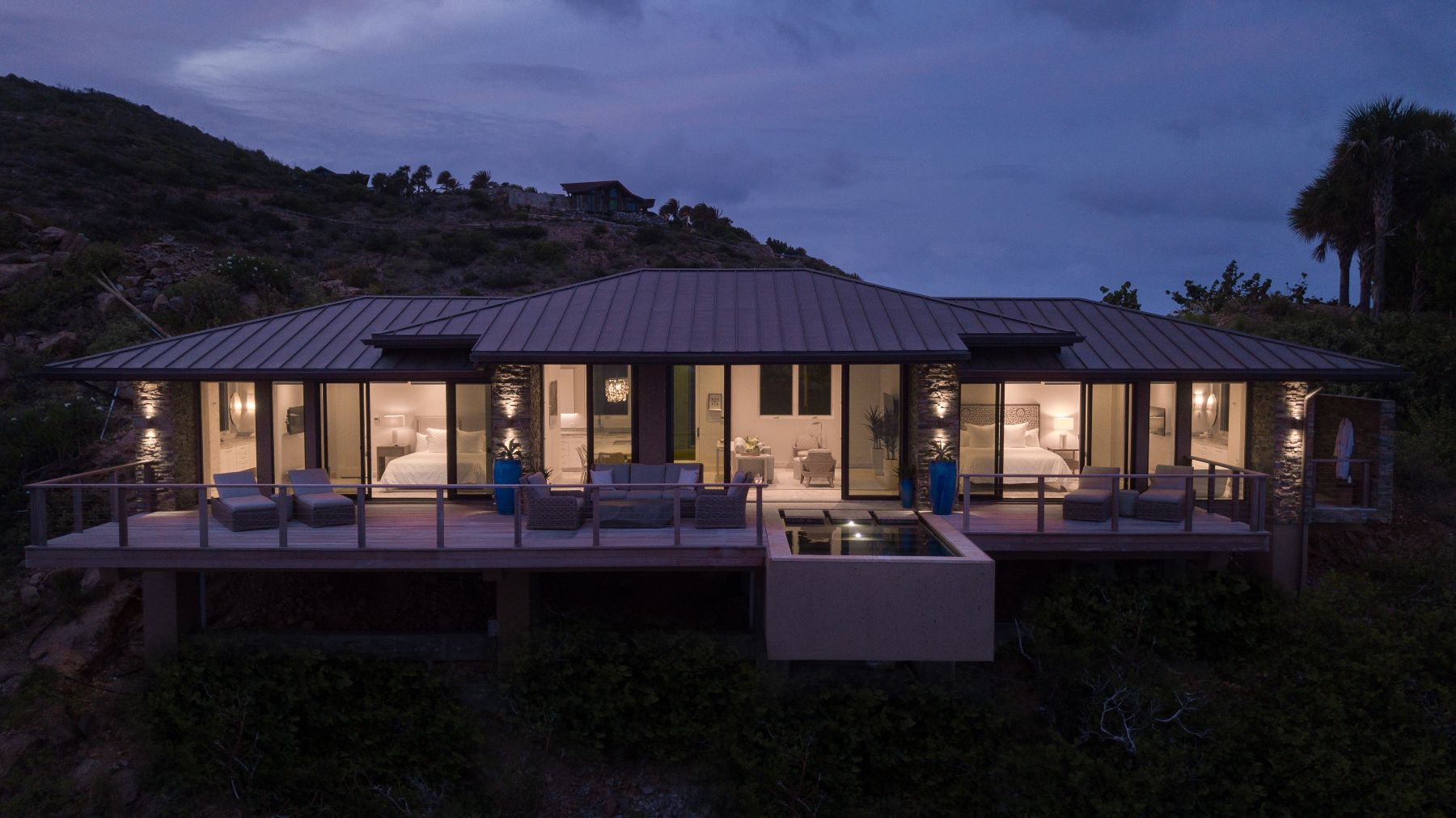 Exterior of villa at night at Whale Point in the Nut Oil Bay Resort in the British Virgin Islands